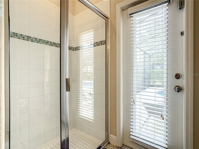 5303 Wildwood Way, Davenport, FL 33837 - bathroom with a shower stall and healthy amount of natural light