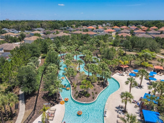 5303 Wildwood Way, Davenport, FL 33837 - aerial view of residential area featuring a pool and a tree filled landscape