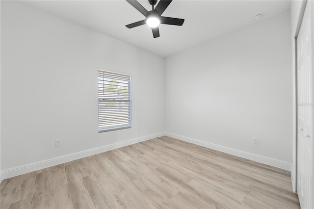 spare room featuring ceiling fan and light wood-type flooring