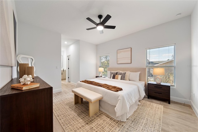 bedroom with light hardwood / wood-style flooring and ceiling fan