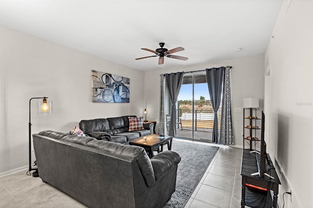 living room featuring ceiling fan and light tile patterned flooring