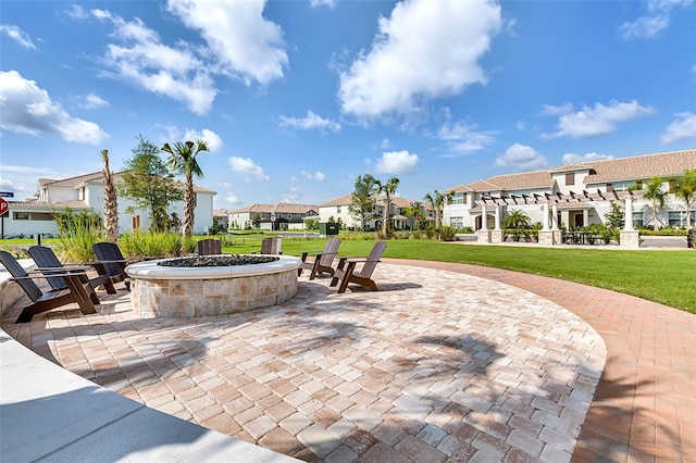 view of patio / terrace with a pergola and an outdoor fire pit