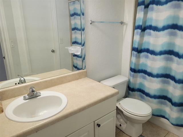 bathroom with tile patterned flooring, vanity, toilet, and a shower with shower curtain