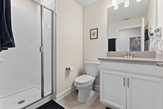 bathroom featuring vanity, a shower with door, tile patterned floors, toilet, and a textured ceiling