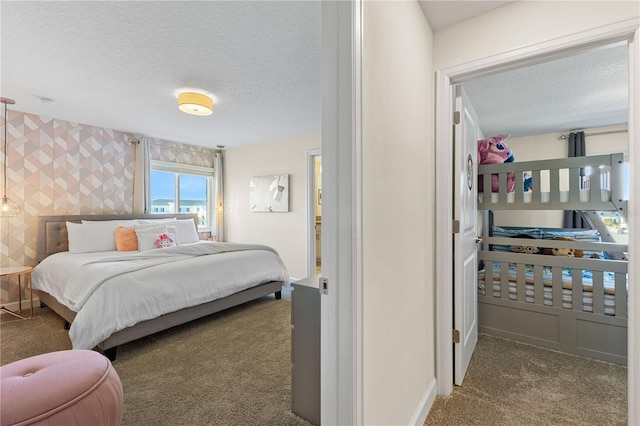 carpeted bedroom with a textured ceiling