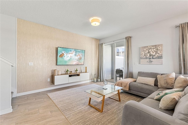 living room featuring a textured ceiling