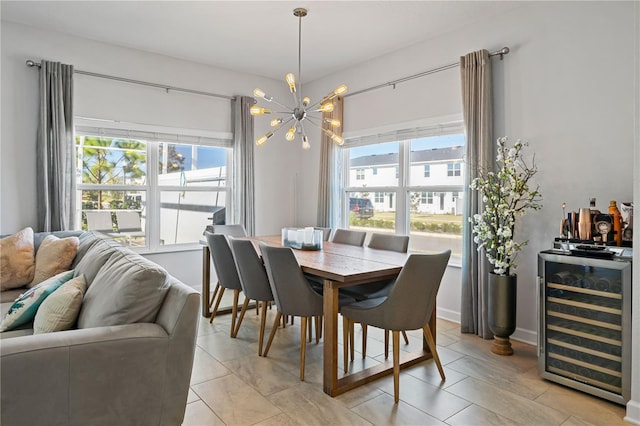 dining space with beverage cooler and a chandelier