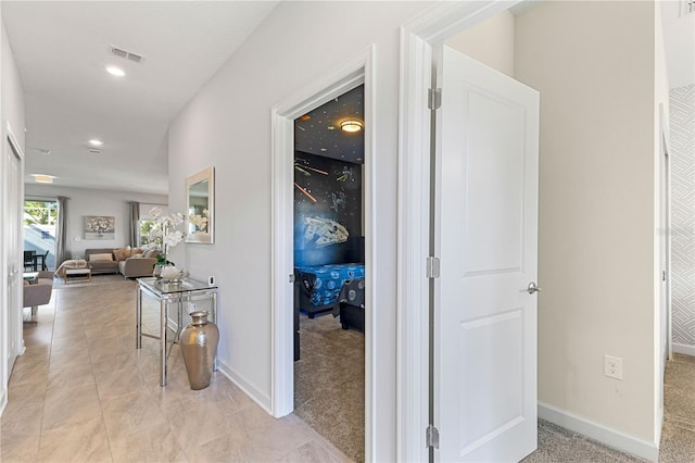 corridor with light colored carpet