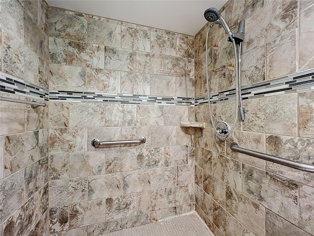 bathroom with a tile shower