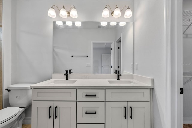 bathroom with vanity and toilet