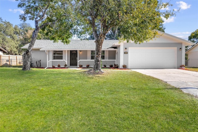 ranch-style house featuring a porch, a garage, and a front lawn