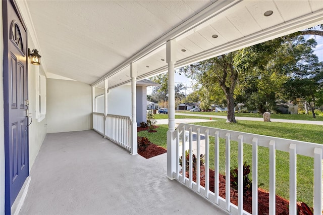 unfurnished sunroom with vaulted ceiling