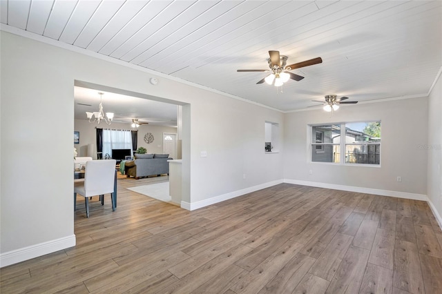 empty room with wood ceiling, wood-type flooring, ceiling fan with notable chandelier, and ornamental molding