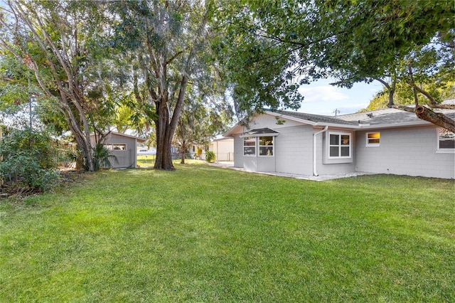 view of yard with a storage shed