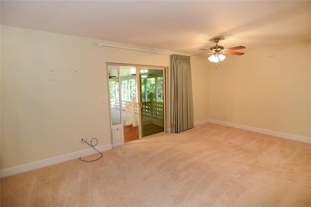 unfurnished room with light carpet and ceiling fan