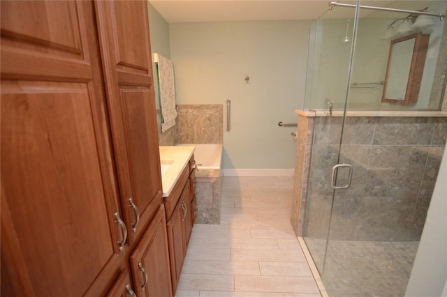 bathroom featuring vanity and independent shower and bath