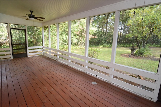 unfurnished sunroom with a wealth of natural light and ceiling fan