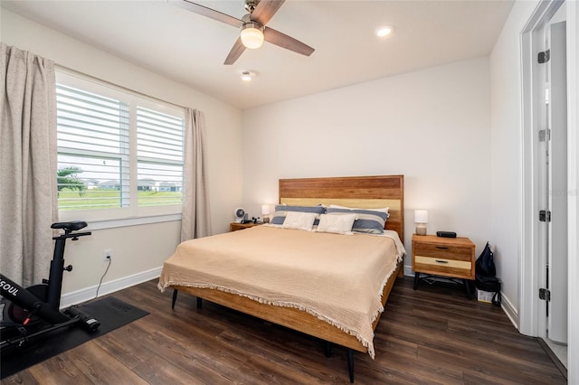 bedroom featuring ceiling fan and dark hardwood / wood-style floors