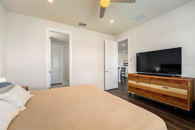 bedroom with ceiling fan and dark hardwood / wood-style flooring