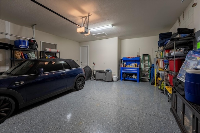 garage featuring a garage door opener