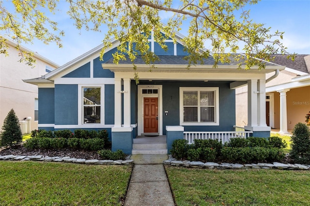 view of front facade with a porch and a front yard