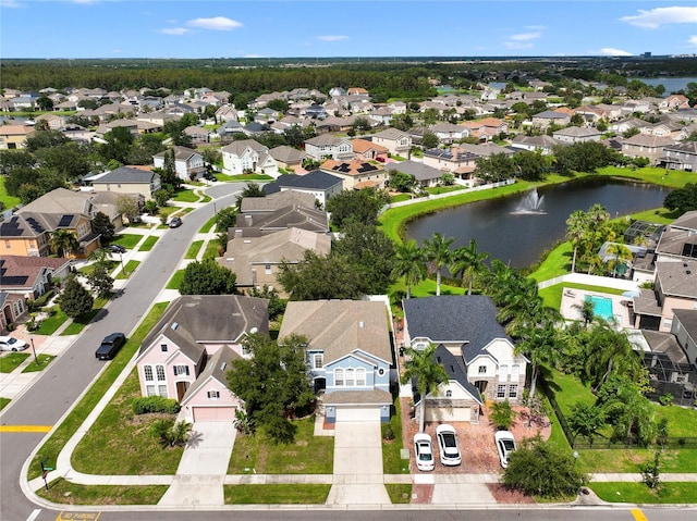 drone / aerial view with a water view