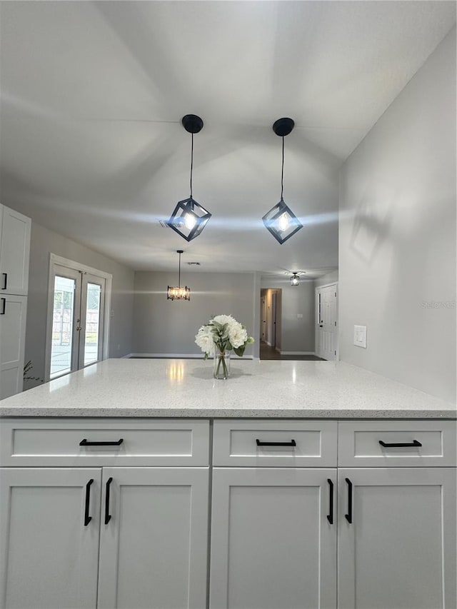 interior details with french doors and ceiling fan