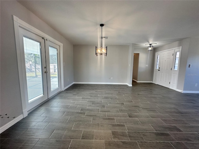 interior space with french doors and ceiling fan