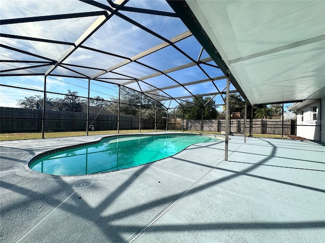 view of pool with a lanai and a patio