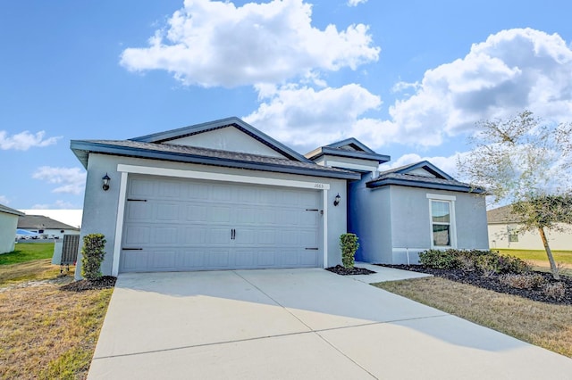 ranch-style house featuring cooling unit and a garage