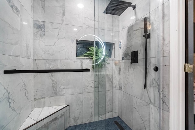 bathroom with a tile shower