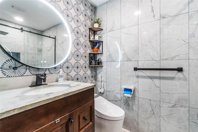 bathroom with toilet, an enclosed shower, and vanity