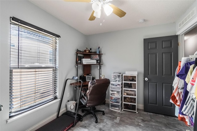 office area featuring a textured ceiling and ceiling fan