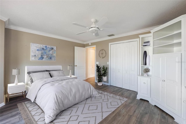 bedroom with a textured ceiling, dark hardwood / wood-style flooring, ceiling fan, and ornamental molding