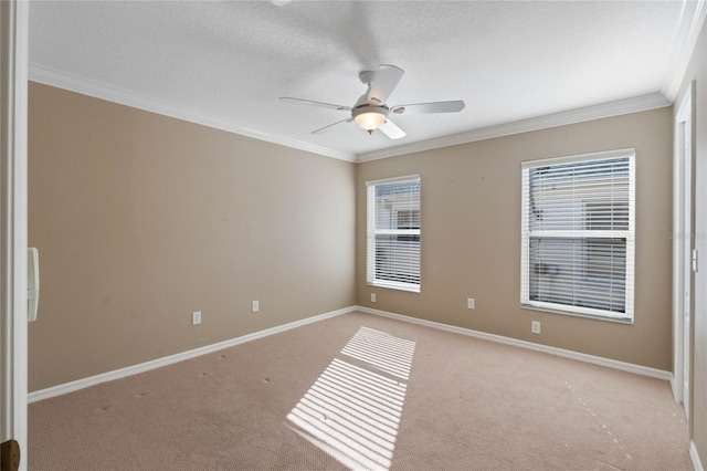 unfurnished room with light carpet, ceiling fan, a textured ceiling, and ornamental molding