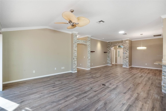 unfurnished living room with crown molding, hardwood / wood-style floors, ceiling fan, and vaulted ceiling