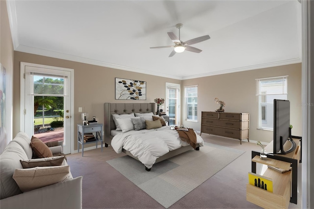 carpeted bedroom with ceiling fan and ornamental molding