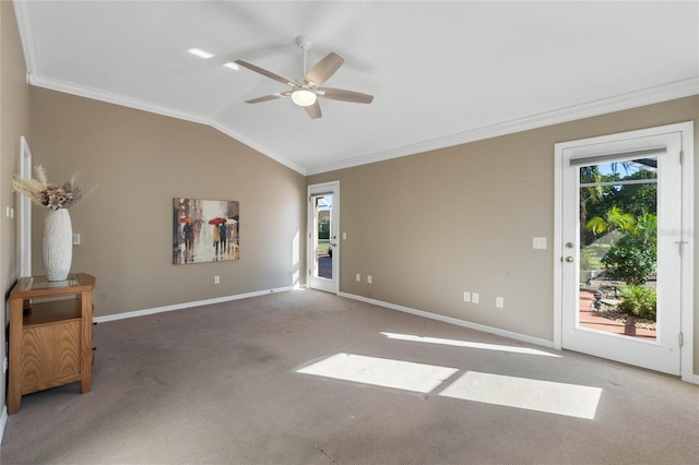 unfurnished living room featuring carpet flooring, ceiling fan, lofted ceiling, and ornamental molding