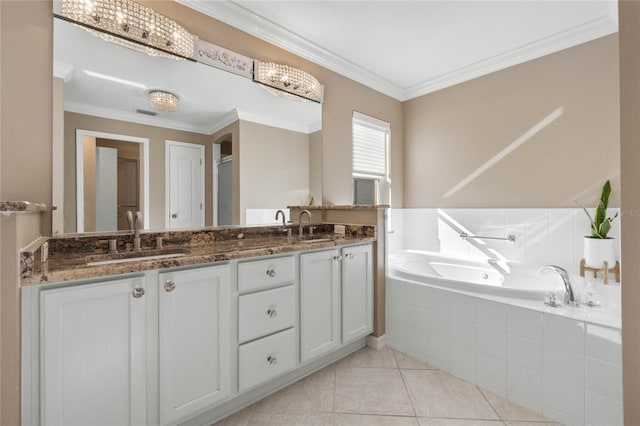 bathroom with tile patterned floors, tiled bath, vanity, and ornamental molding