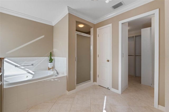 bathroom with tile patterned floors, crown molding, and independent shower and bath