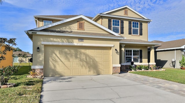 craftsman-style home featuring a front yard and a garage