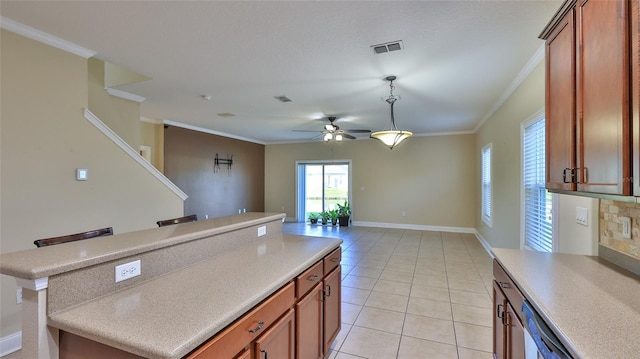 kitchen with a kitchen breakfast bar, ceiling fan, crown molding, dishwasher, and light tile patterned flooring