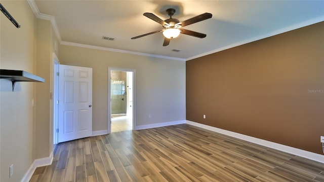 interior space with ceiling fan, hardwood / wood-style floors, and ornamental molding