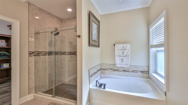 bathroom with crown molding and independent shower and bath