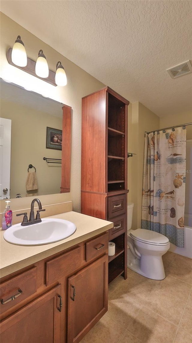 full bathroom featuring shower / bath combo, tile patterned flooring, a textured ceiling, toilet, and vanity