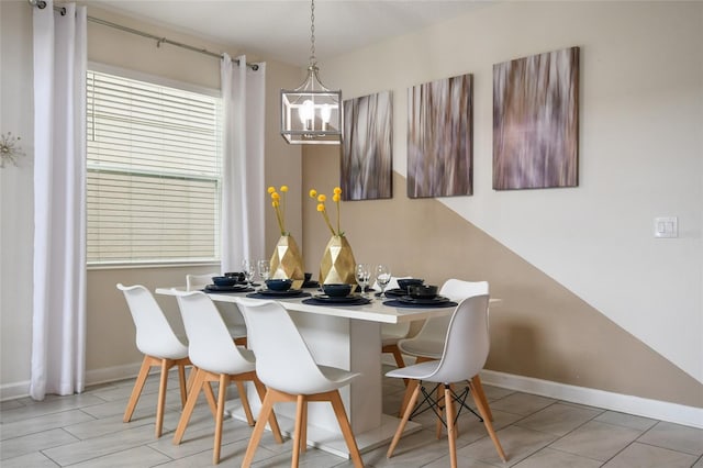 8942 Cabot Cliffs Dr, Davenport, FL 33896 - dining room with a chandelier and baseboards