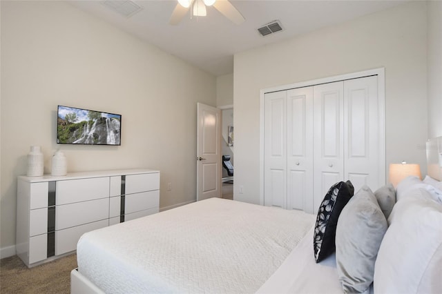 carpeted bedroom featuring a closet and ceiling fan