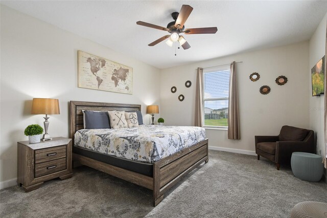 8942 Cabot Cliffs Dr, Davenport, FL 33896 - bedroom featuring dark carpet and a ceiling fan