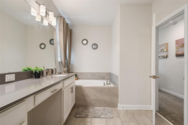 8942 Cabot Cliffs Dr, Davenport, FL 33896 - bathroom with vanity, a bath, and tile patterned floors