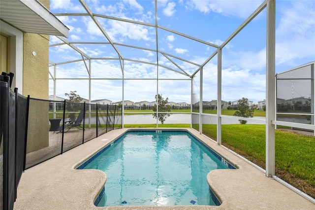 view of pool featuring a lawn, a patio area, a lanai, and a water view